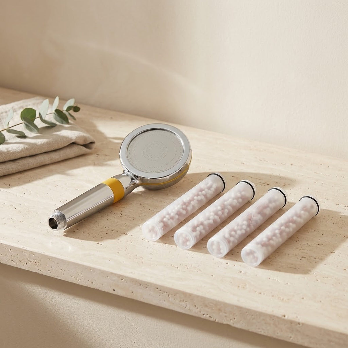 Illustration: the Driftrain handheld with 4 spare cartridges on a travertine bathroom ledge (AI-made image)